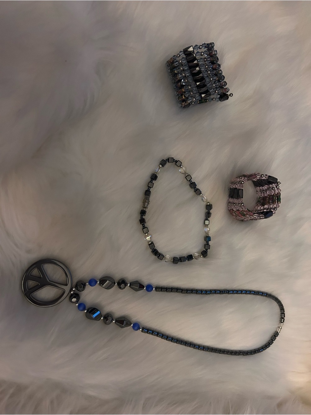 Two Magnetic Hematite Cloisonne Flower Pearl Beads and other hematite bracelet.